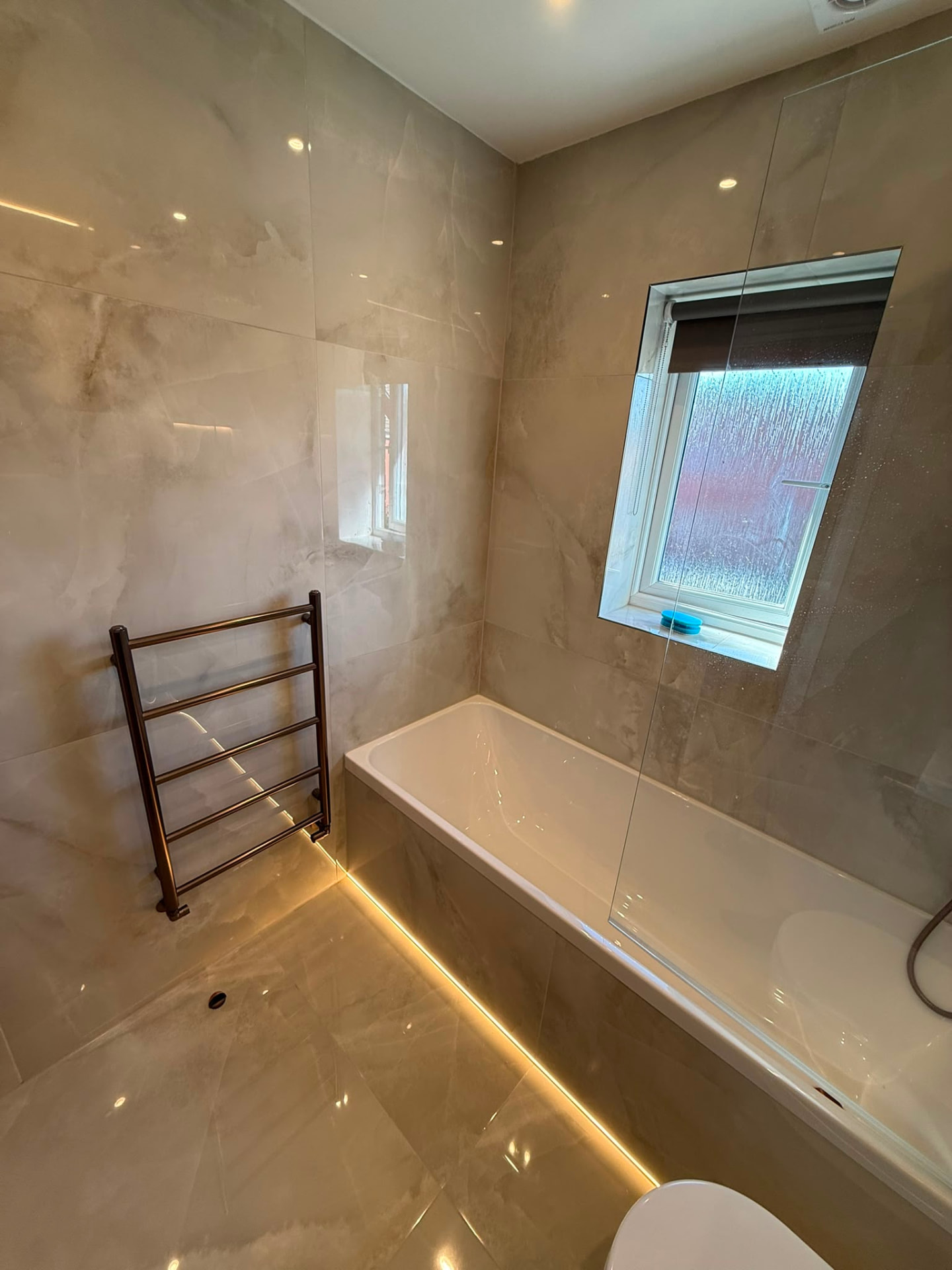 Luxury marble-effect bathroom installation completed by DPS Plumbing & Bathrooms in Greater Manchester