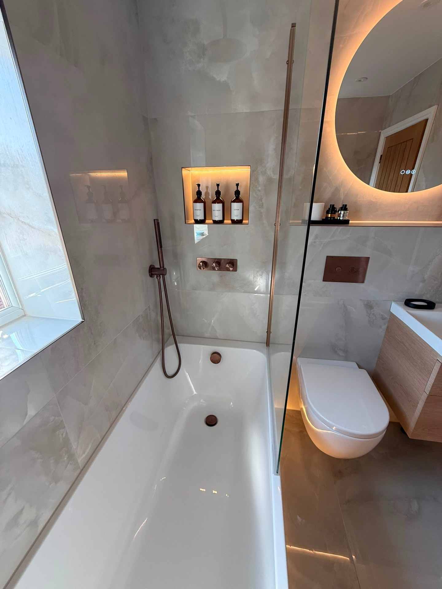Bath with Glass Screen, Lit Niche & Wall-Hung WC by DPS Plumbing & Bathrooms in Prestwich, Bury