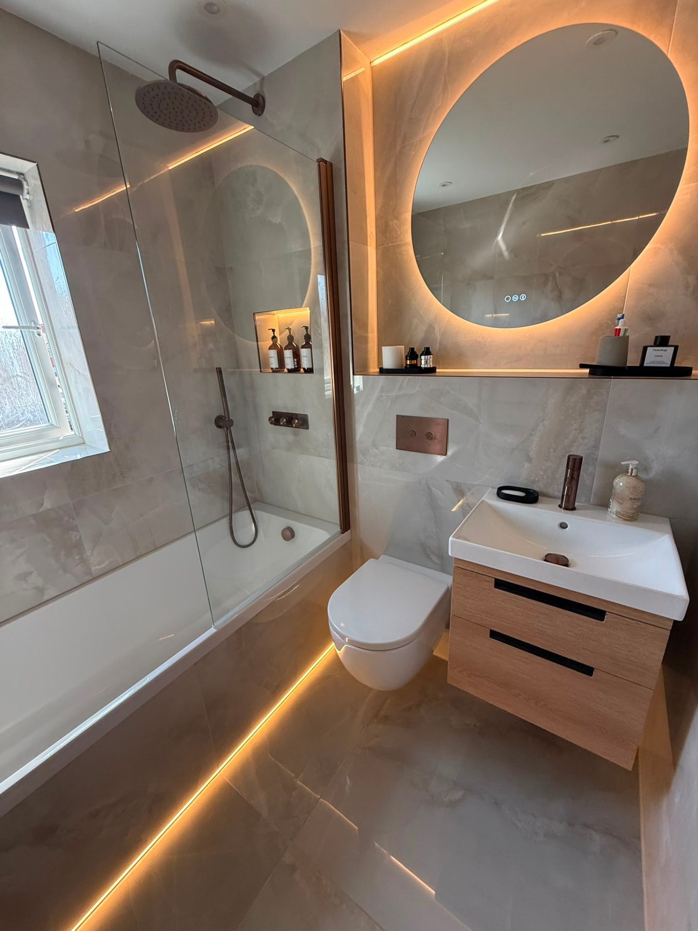 Bronze Rainfall Shower & Floating Oak Vanity by DPS Plumbing & Bathrooms in Chorlton, Manchester